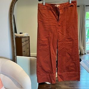 Anthropologie orange flare pants